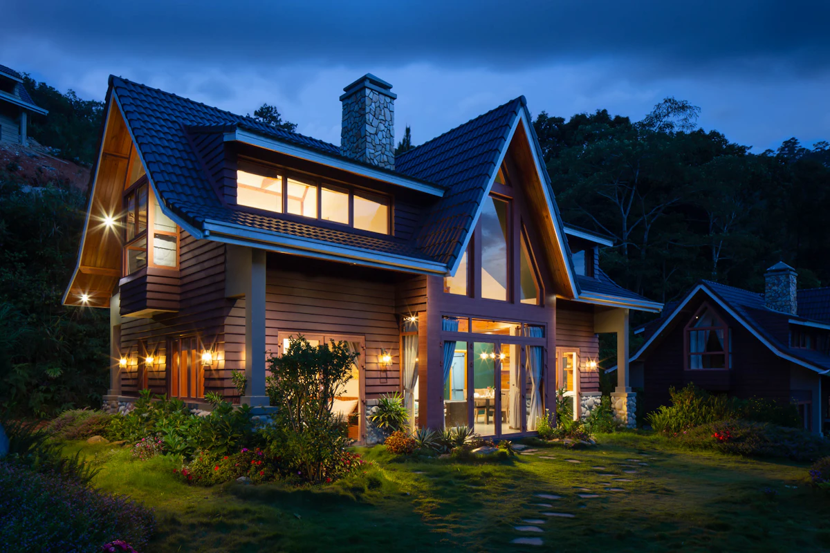 Connecticut vacation home with stone facade surrounded by autumn trees, no occupants visible