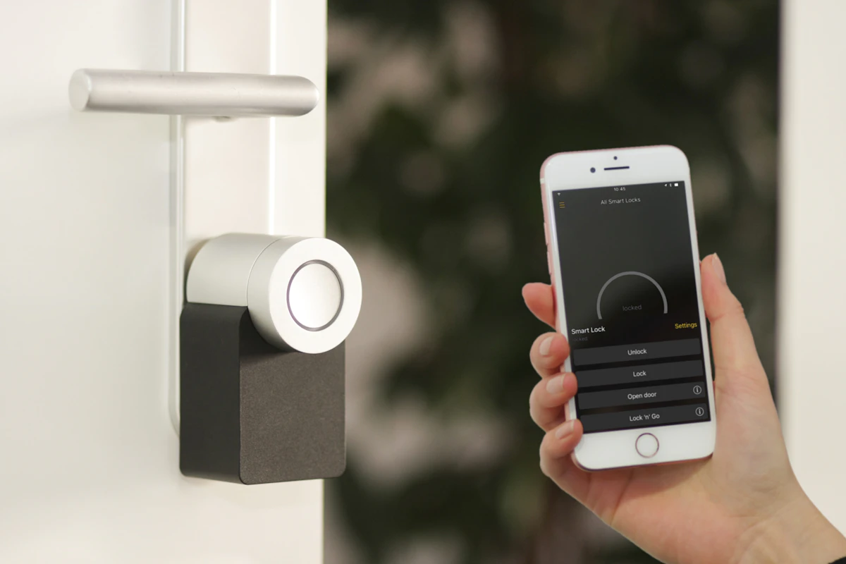 Modern home exterior with professional security cameras installed at entry points